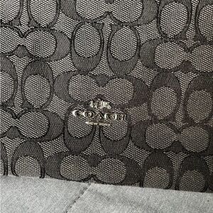 Coach Charcoal and black Signature Pattern Bag.
